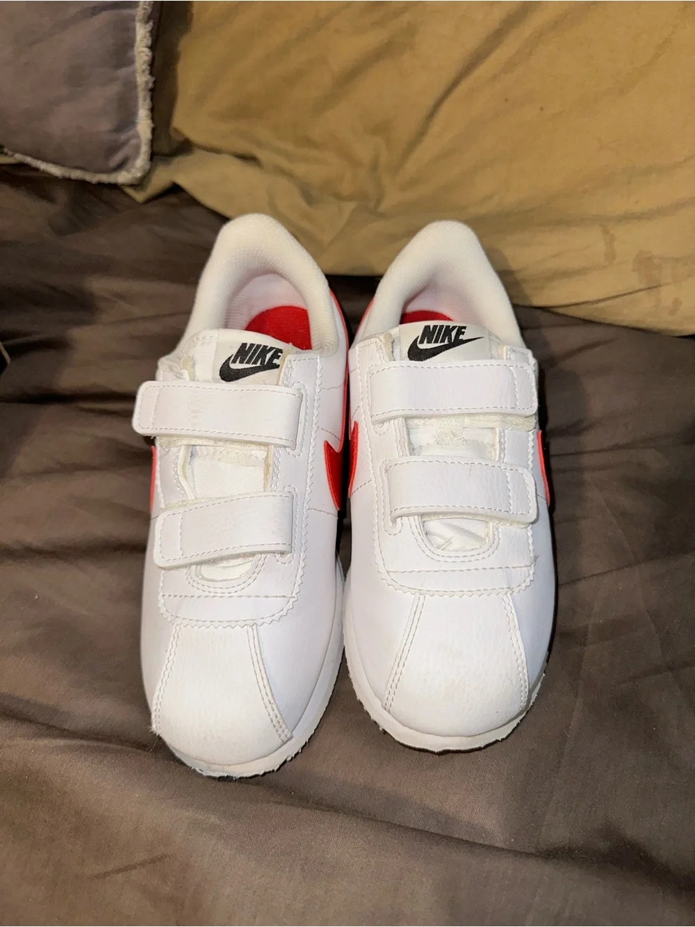 Nike Kids White Sneaker with Red Swoosh
